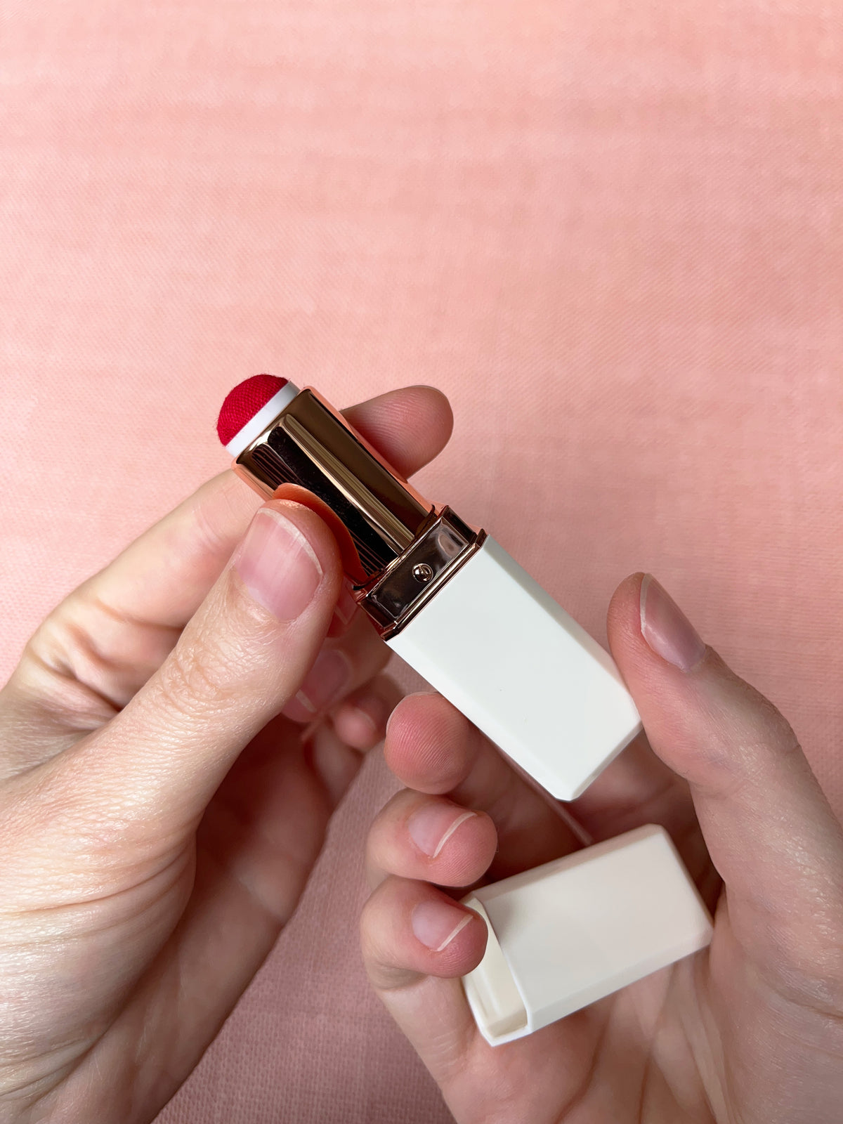 Lipstick needle holder