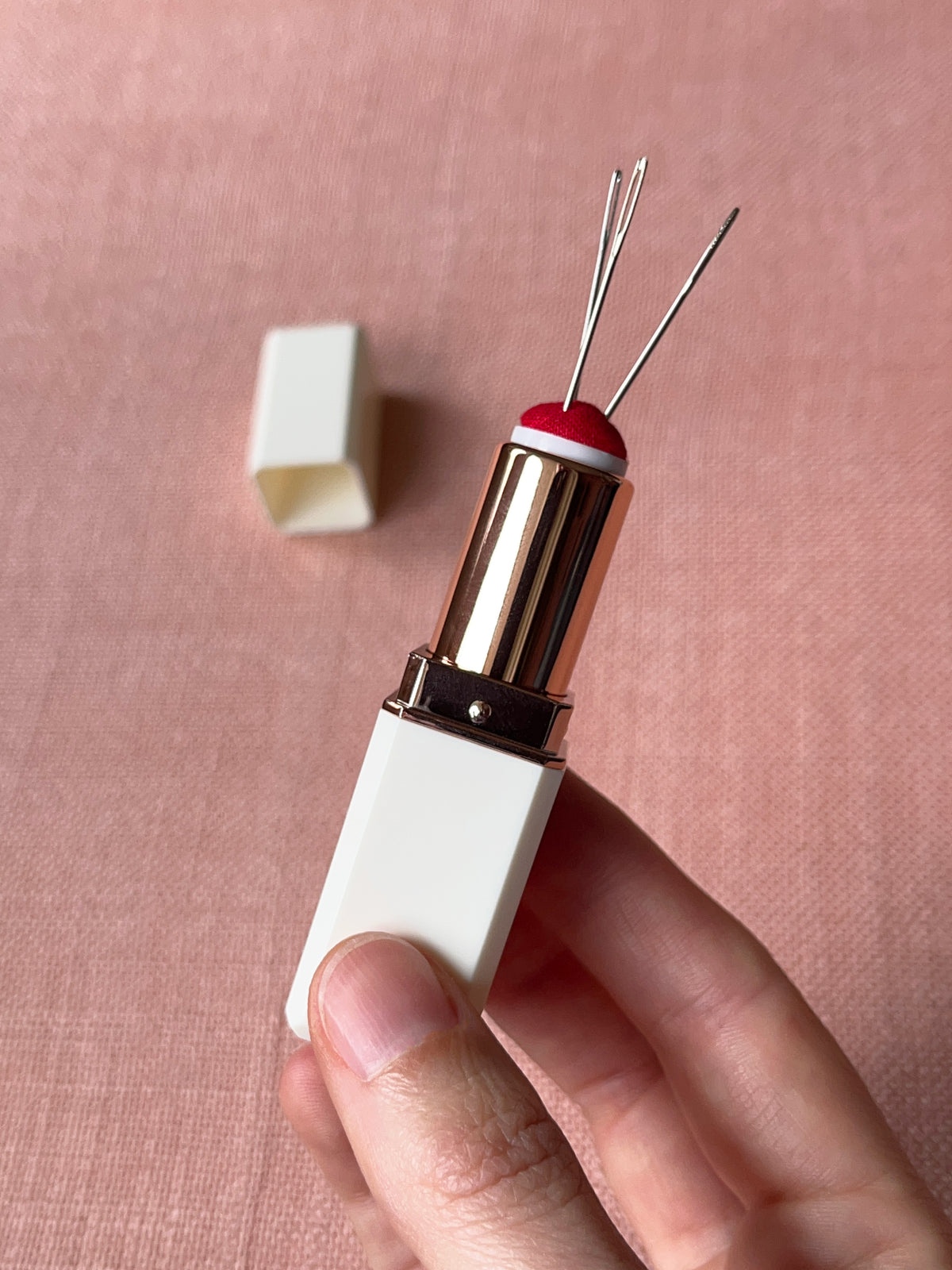 Lipstick needle holder